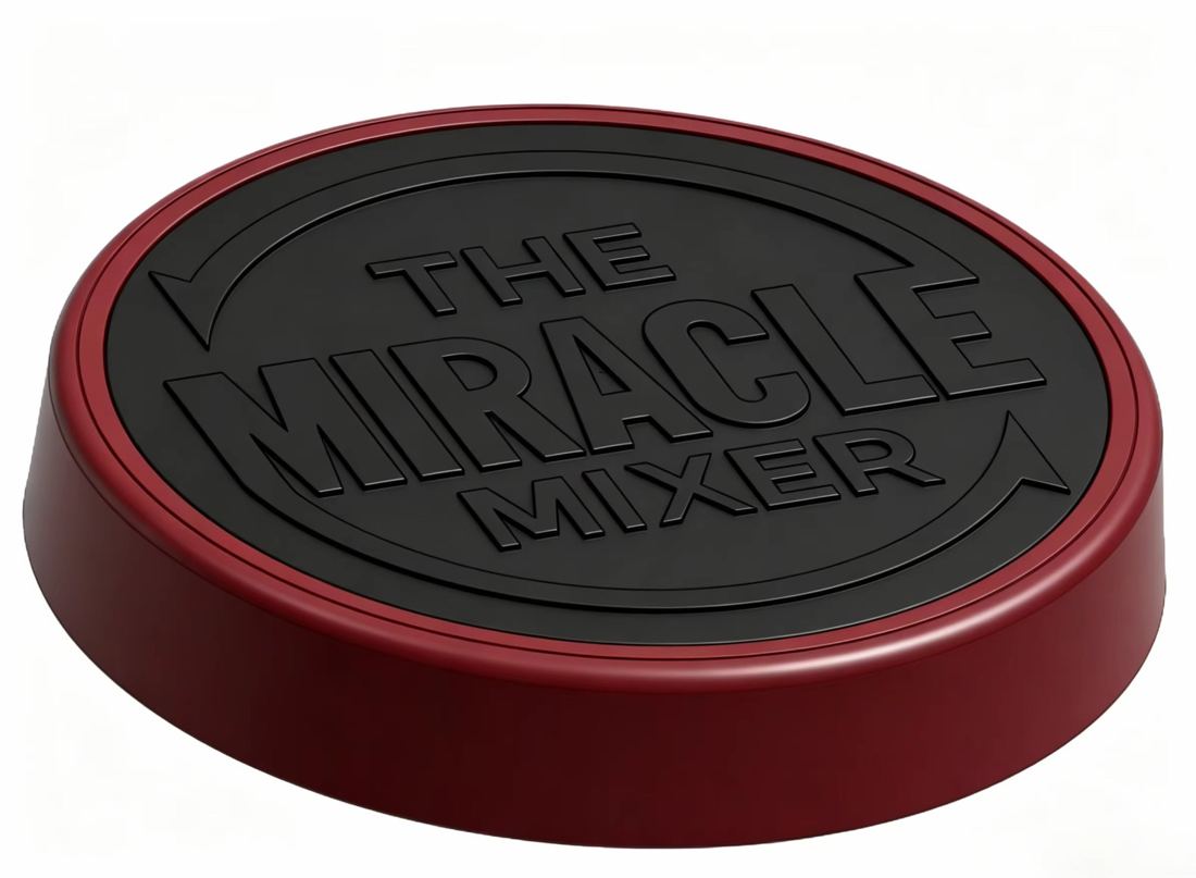 Close-up of The Miracle Mixer red lid knob with logo